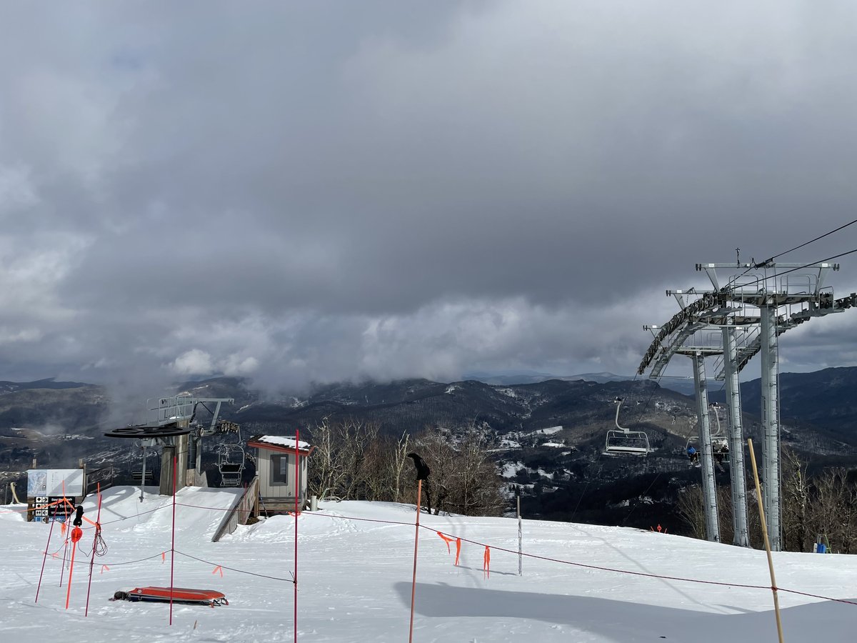 Chairlift unloading area at the snowy summit of Sugar Mountain ski area, NC.
