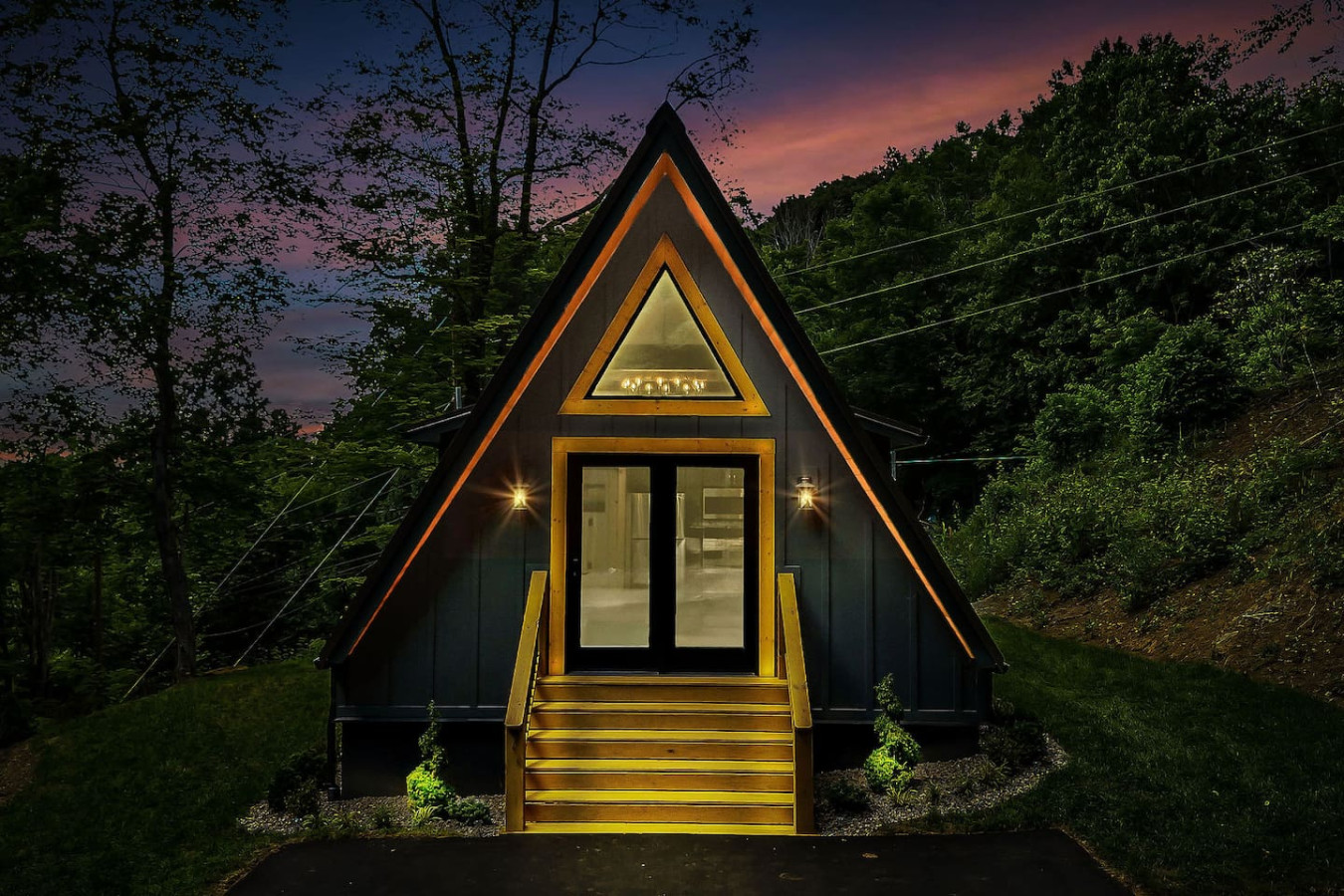 High Peak A-frame at twilight, front entrance and driveway