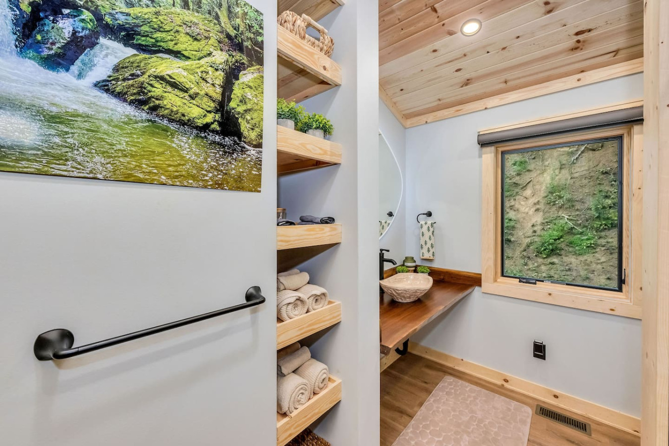 Spa bathroom with live-edge vanity, vessel sink, and towel shelves